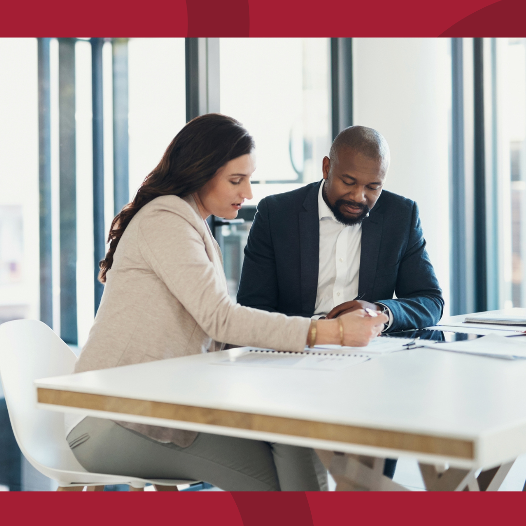 Two business people looking over a document